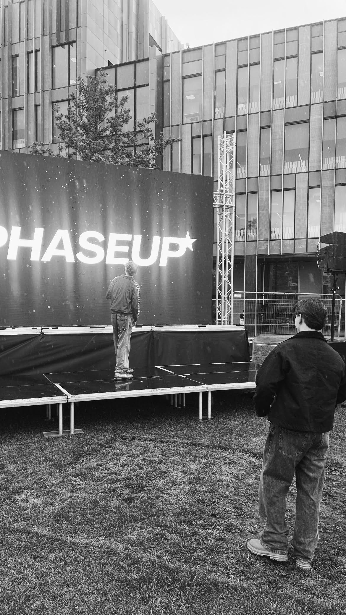 PHASEUP preparing an outdoor stage